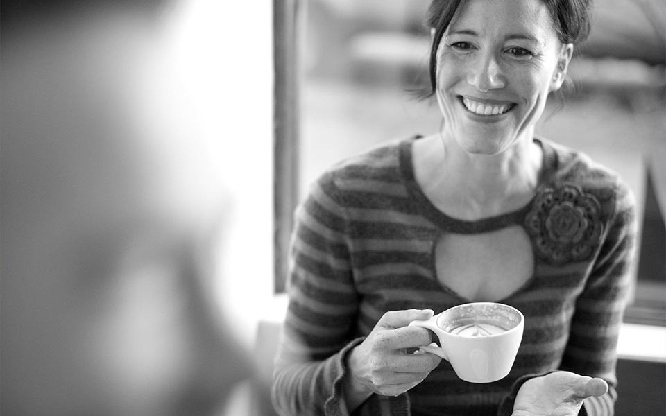 Woman drinking coffee black and white