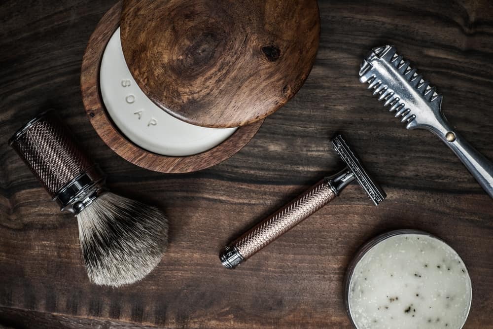 Shaving accessories on a luxury wooden background